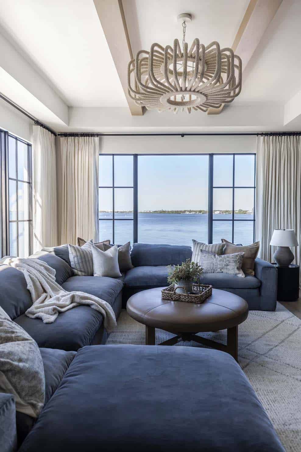 rustic modern coastal style family room with a large blue sectional 