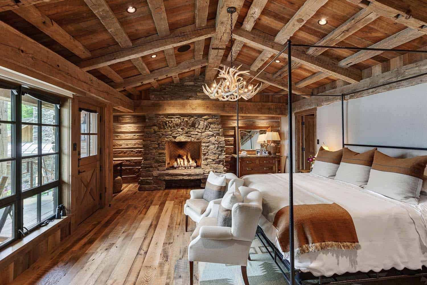 rustic bedroom with a fireplace