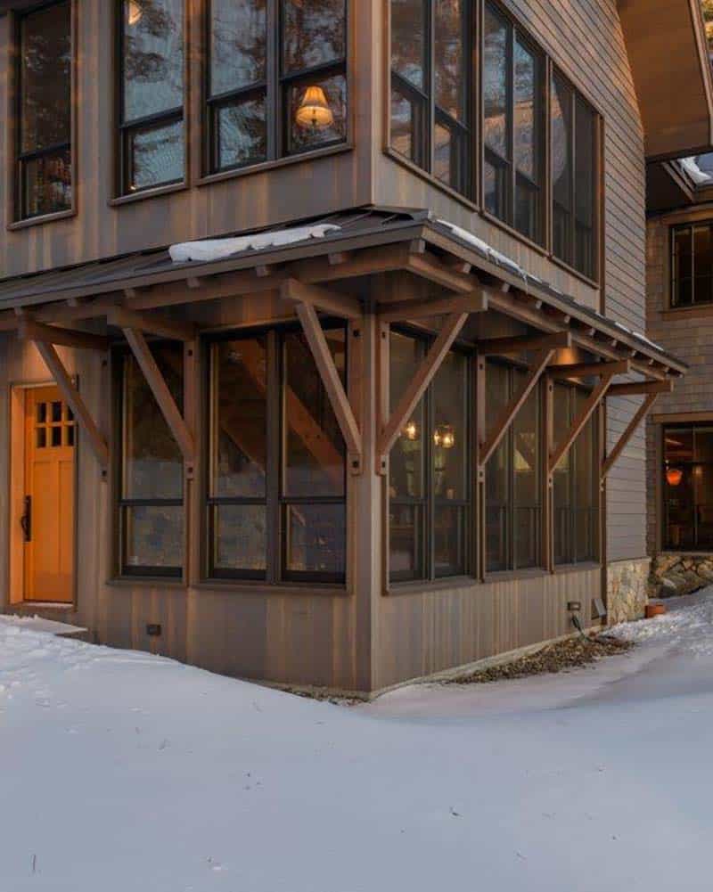 rustic lake house exterior with snow