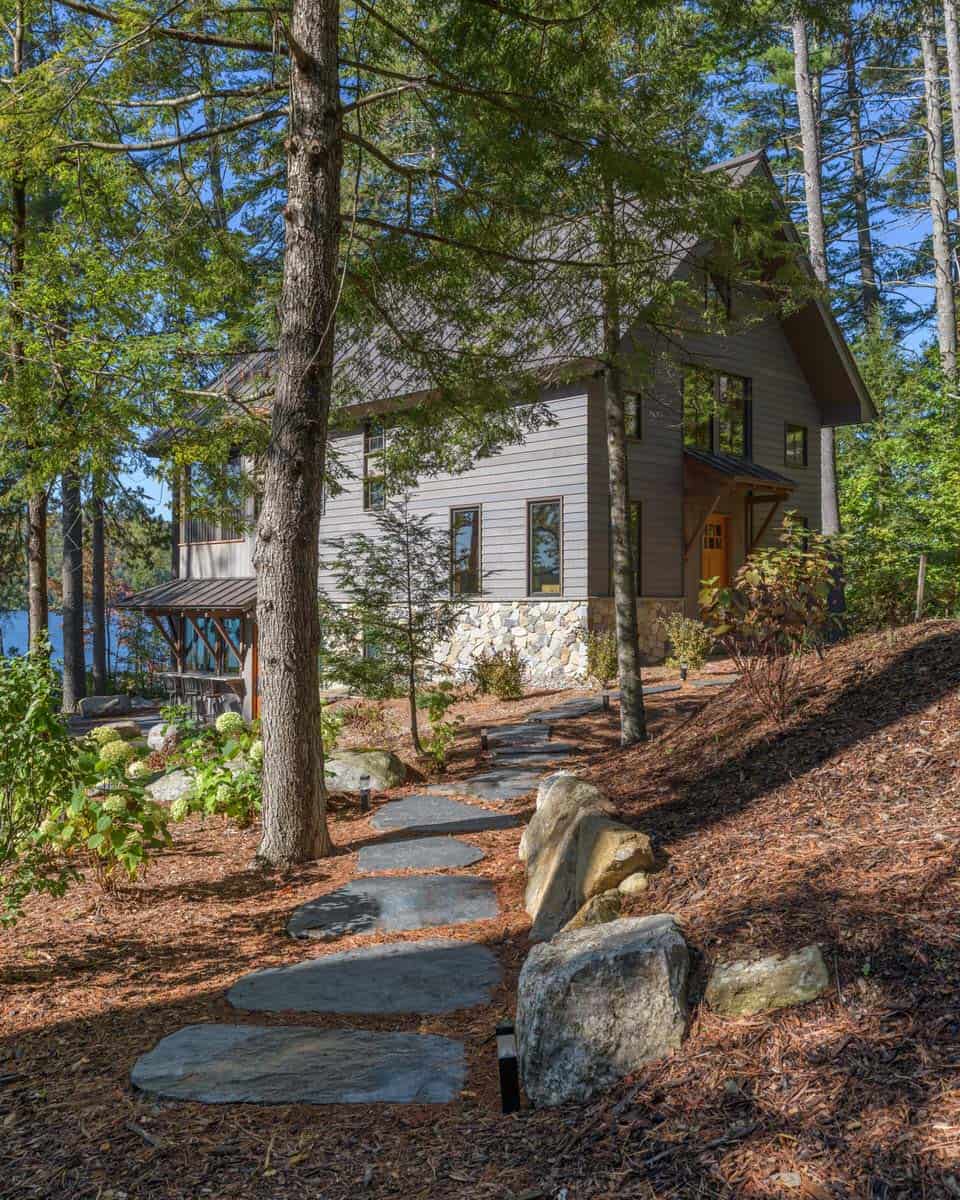 rustic lake house exterior with a pathway