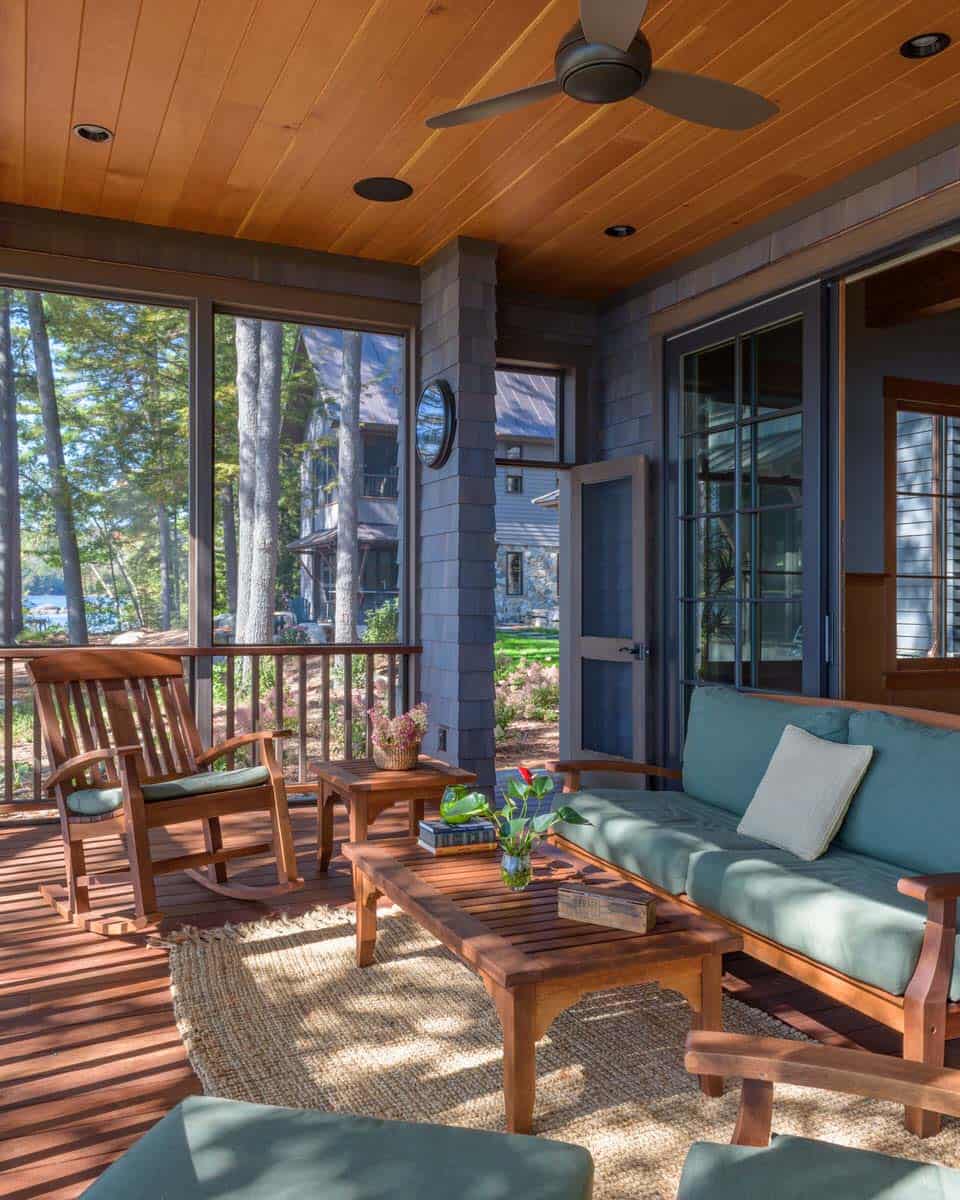 rustic screened porch with outdoor furniture