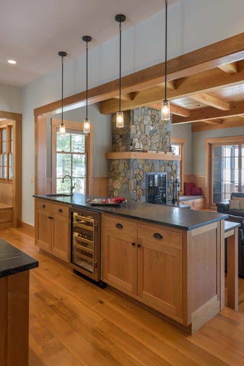 rustic kitchen with an island and pendant lights