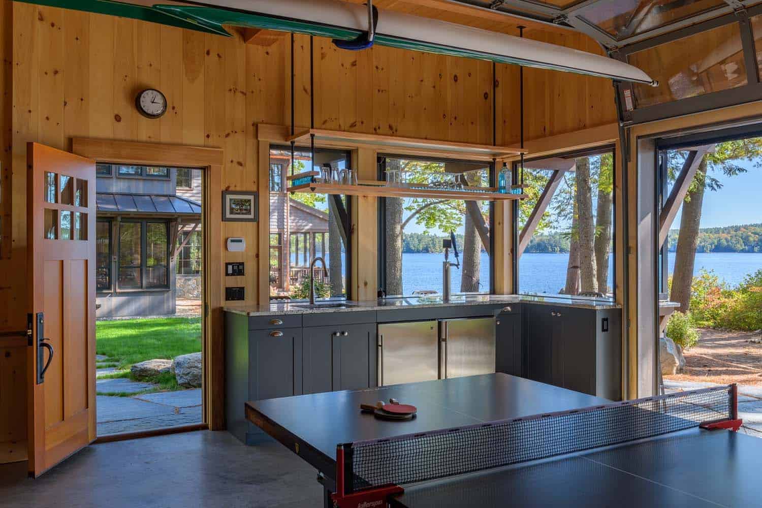 rustic garage with a home bar and a ping pong table