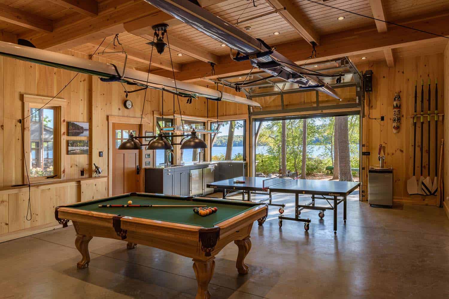 rustic garage with a pool and ping pong table