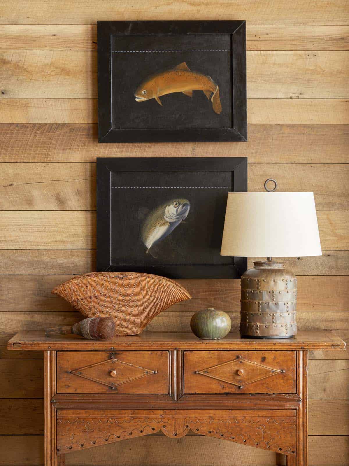rustic table with accessories and artwork on the wall