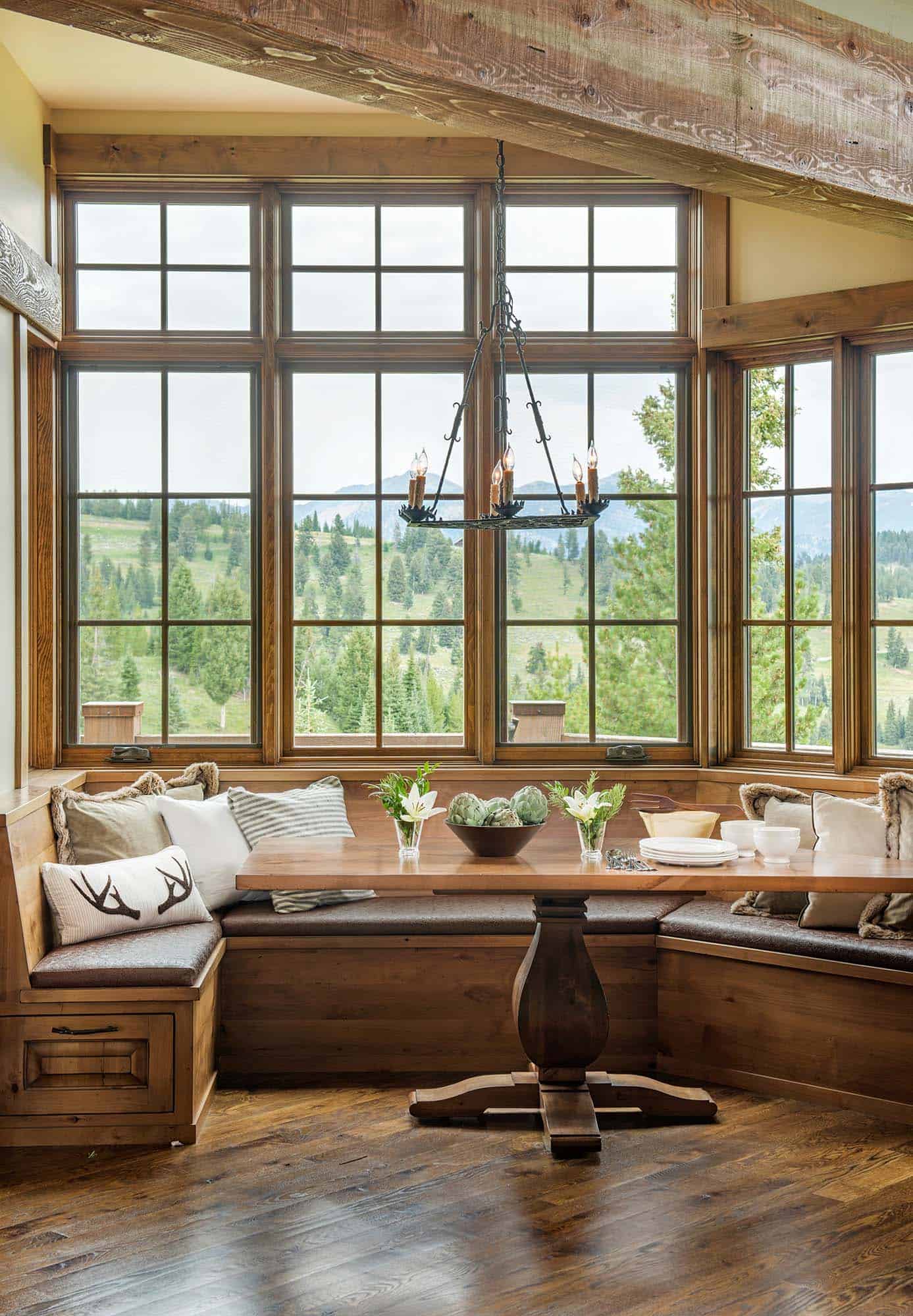 rustic dining breakfast nook with a large window