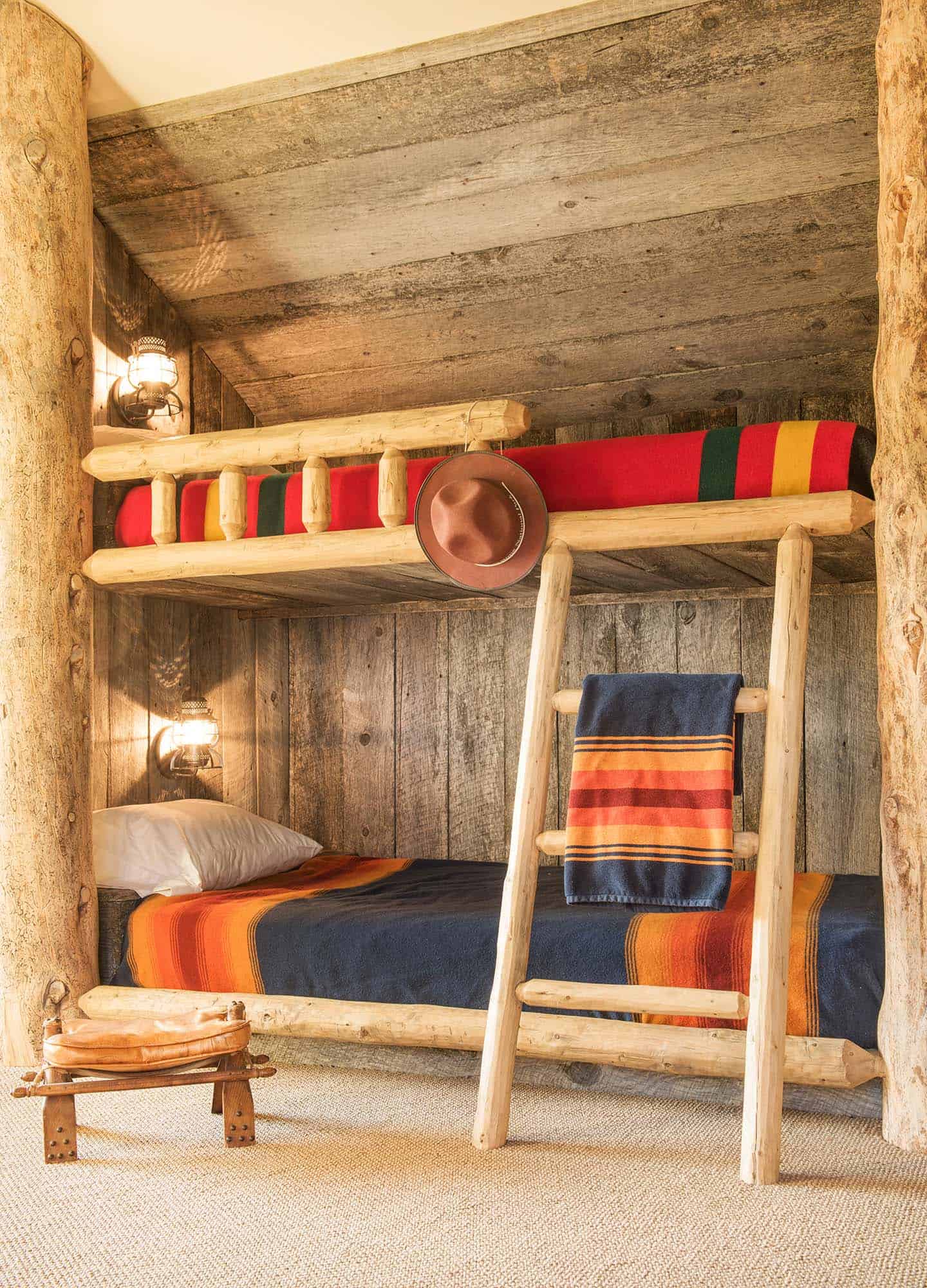 rustic bunk bedroom with a ladder