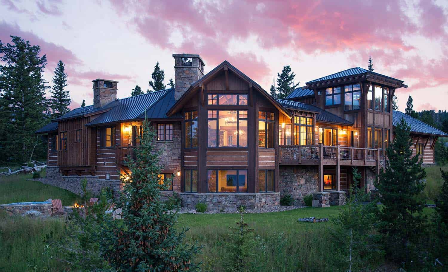 rustic timber frame mountain home exterior at dusk