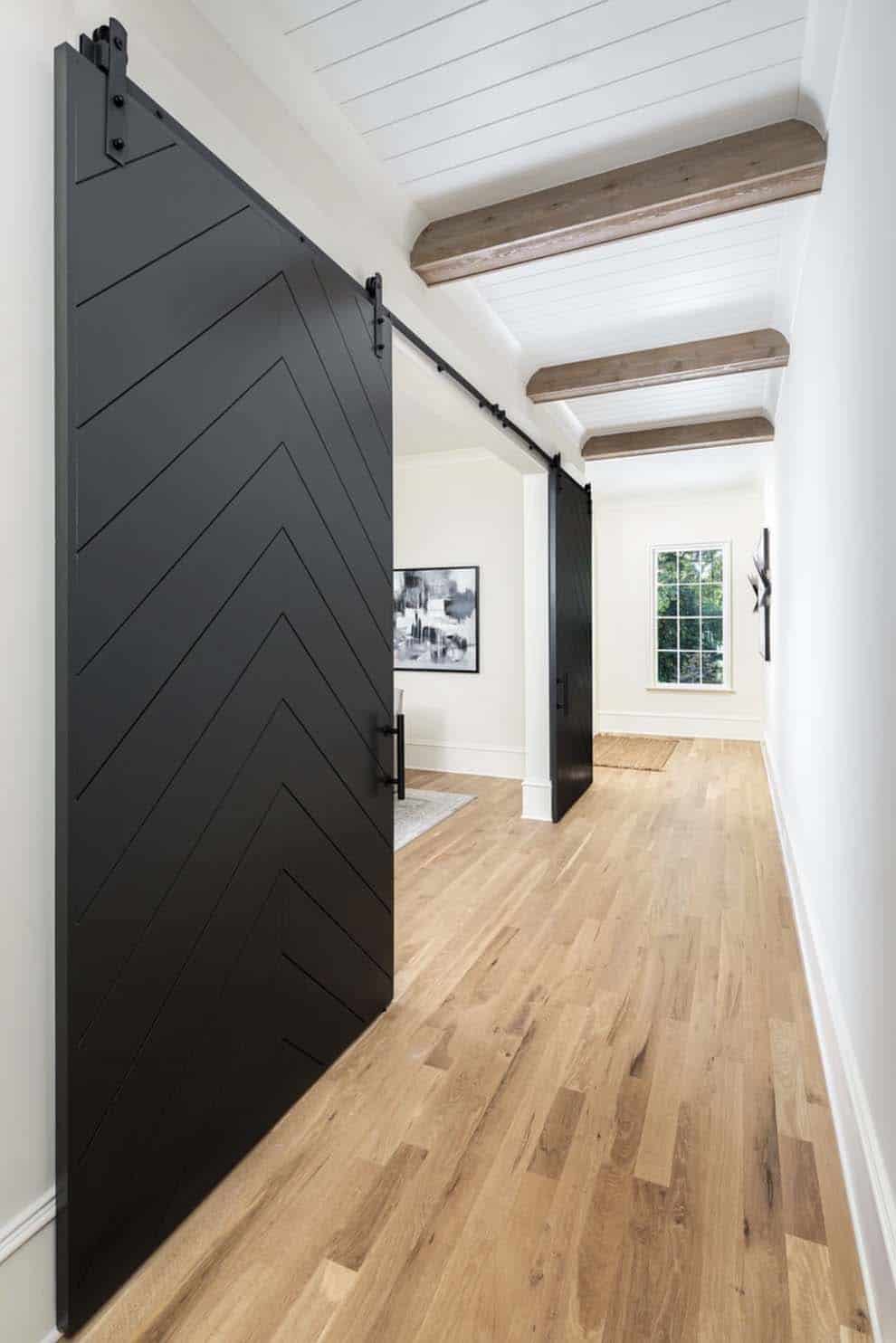 contemporary hallway with sliding barn doors