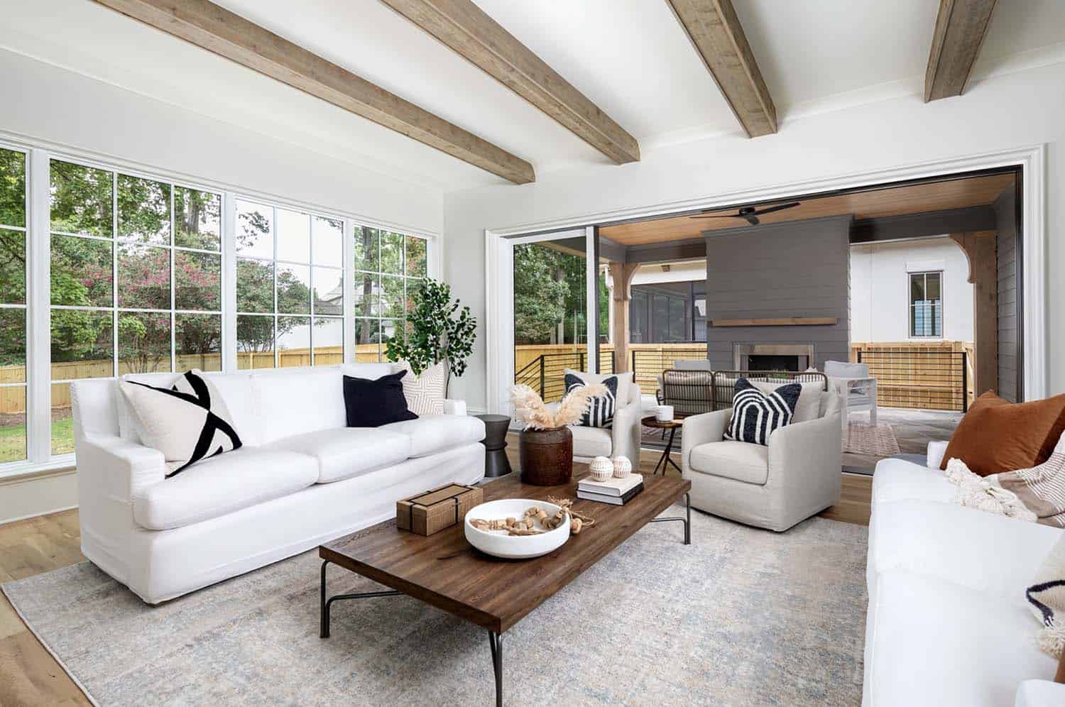 contemporary living room with wood ceiling beams