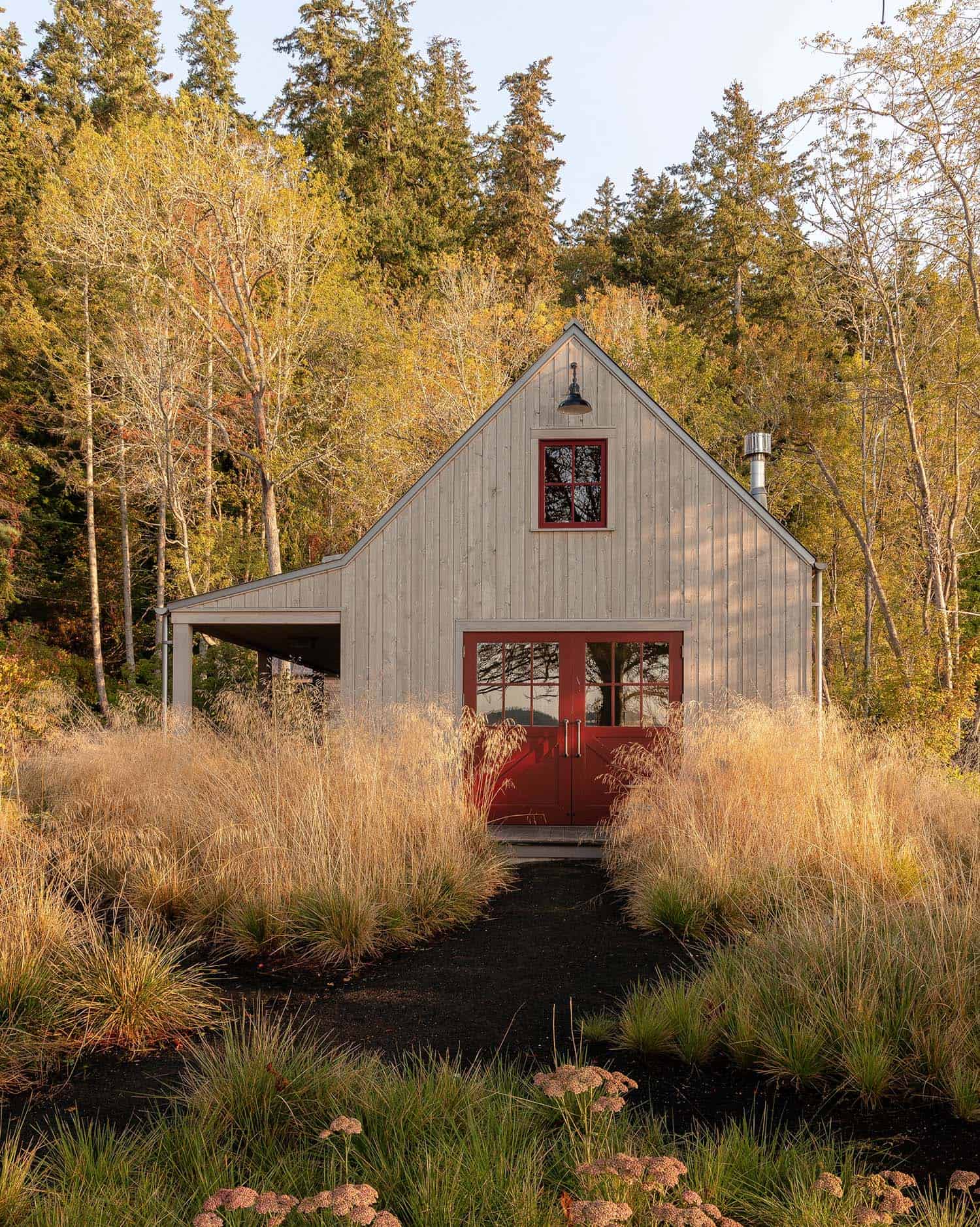beach house art studio exterior with a forest backdrop