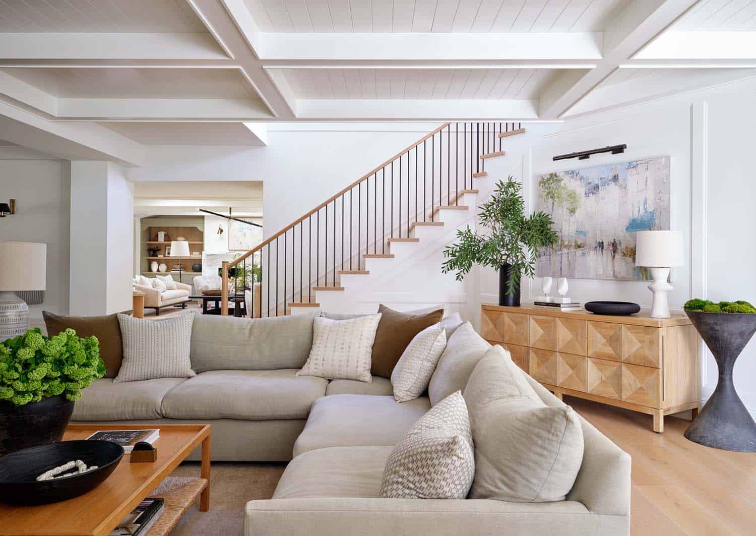 transitional family room with a staircase