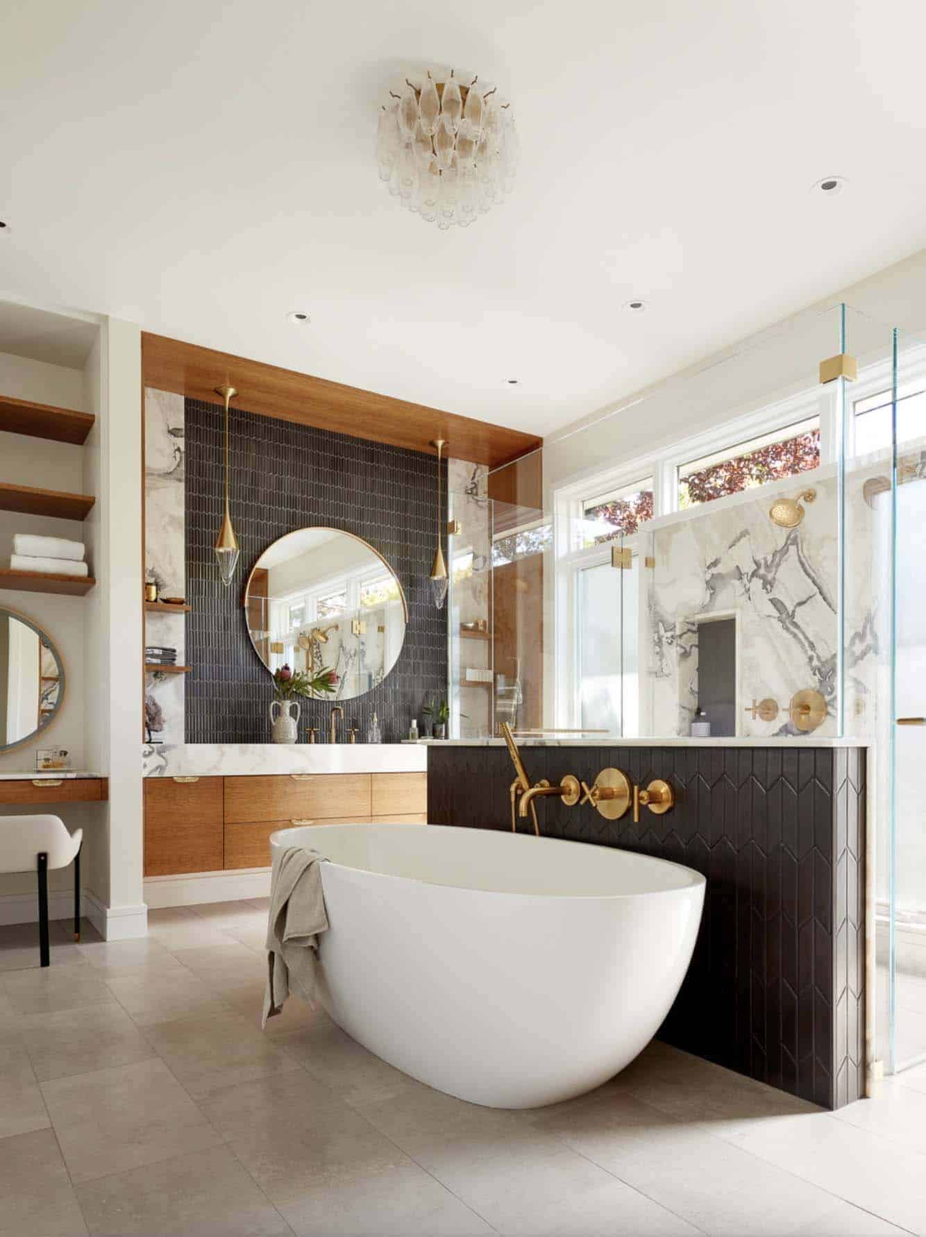 transitional style bathroom with a vanity and freestanding tub with a shower