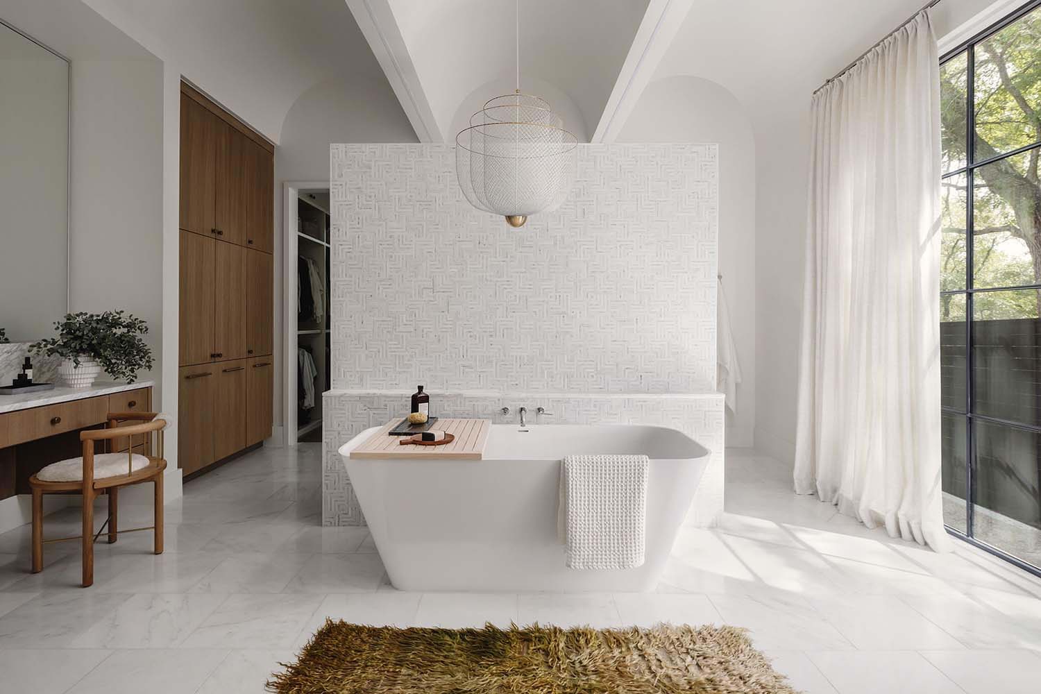 transitional style bathroom with a freestanding tub