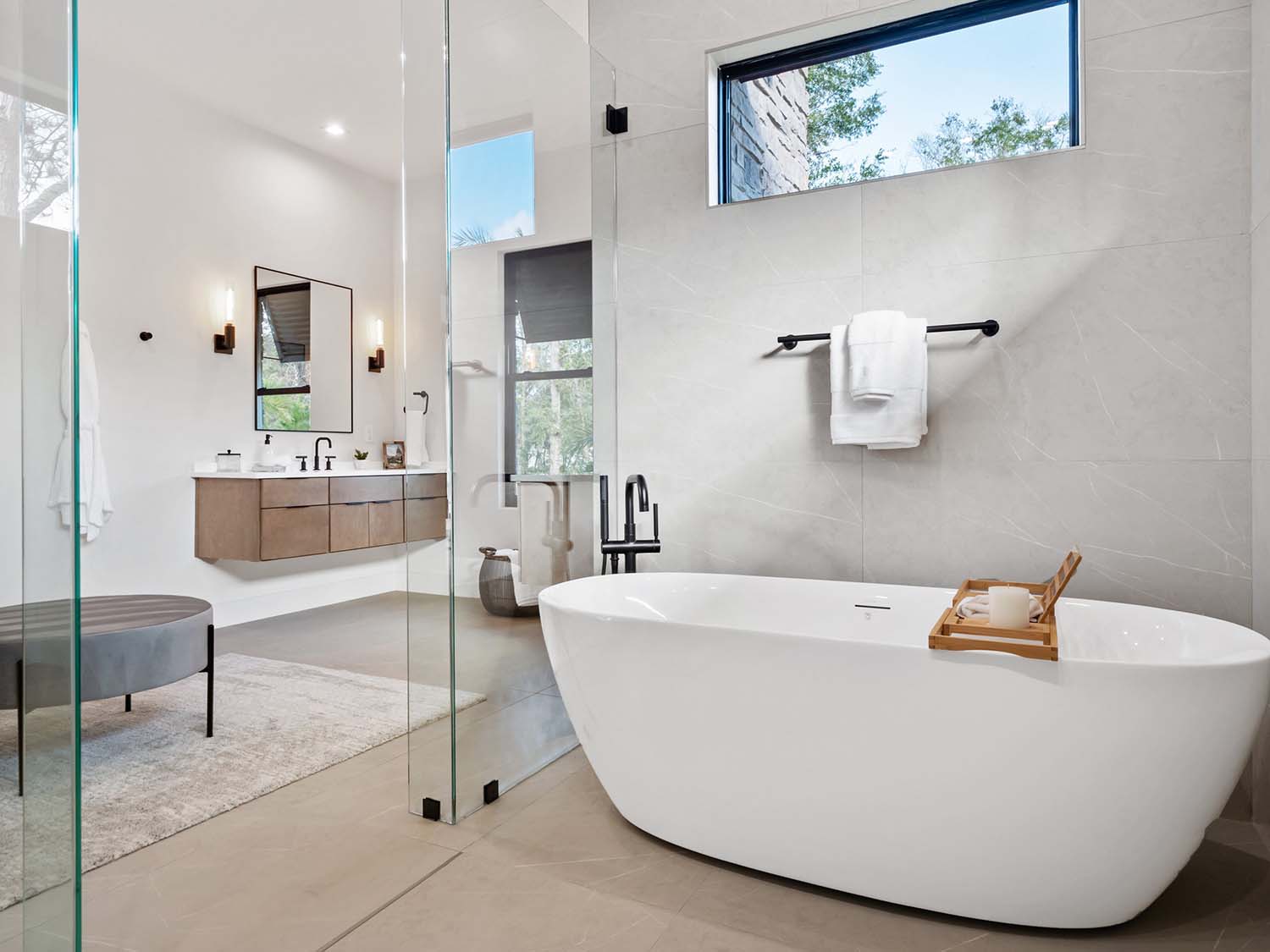 modern bathroom with a walk-in shower and freestanding tub