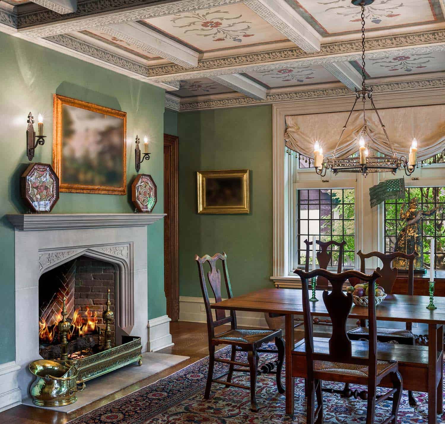 tudor style dining room with a fireplace