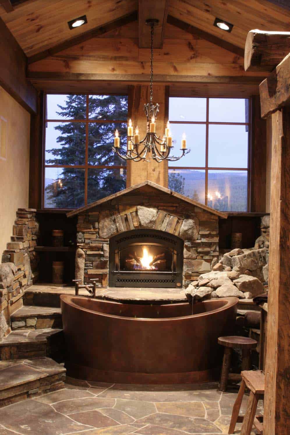 rustic bathroom with a copper tub and fireplace