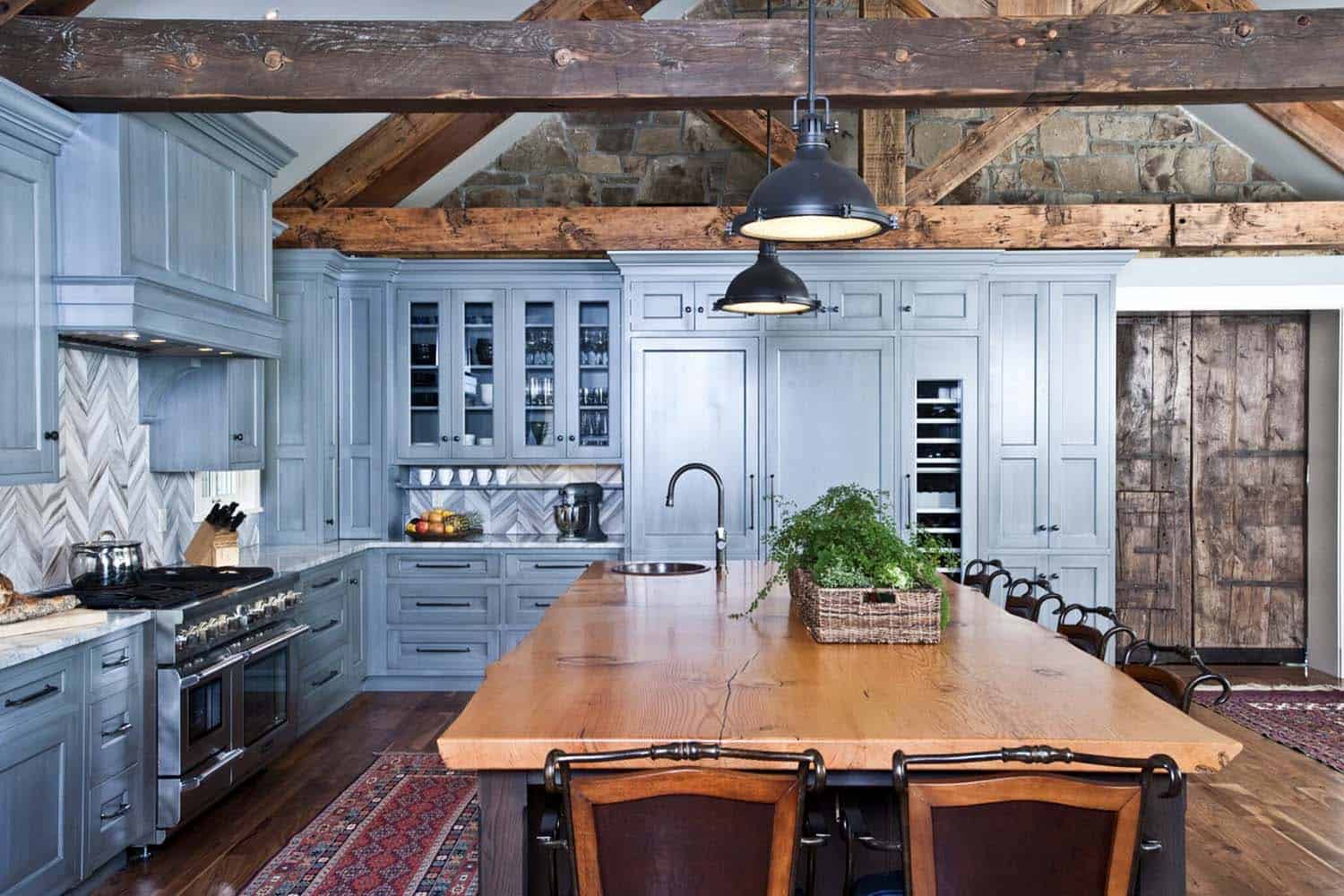 rustic kitchen with wood beams and blue cabinets