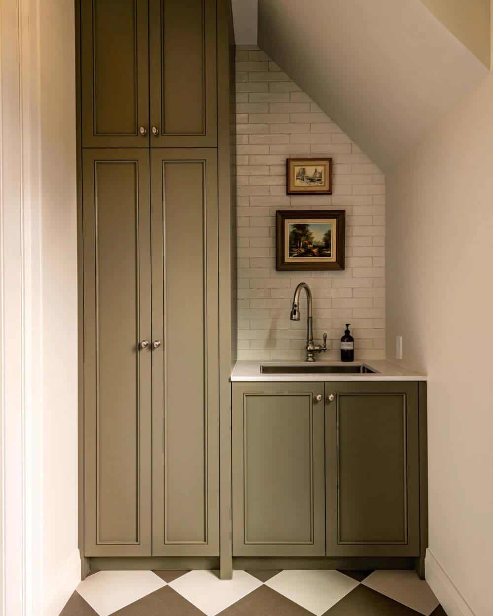 contemporary laundry room sink and storage cabinet with an olive green paint