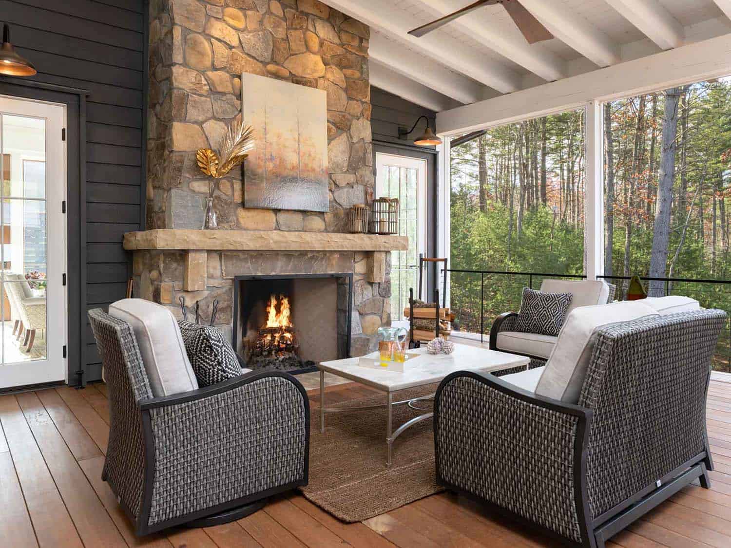 contemporary farmhouse style screened porch with a fireplace