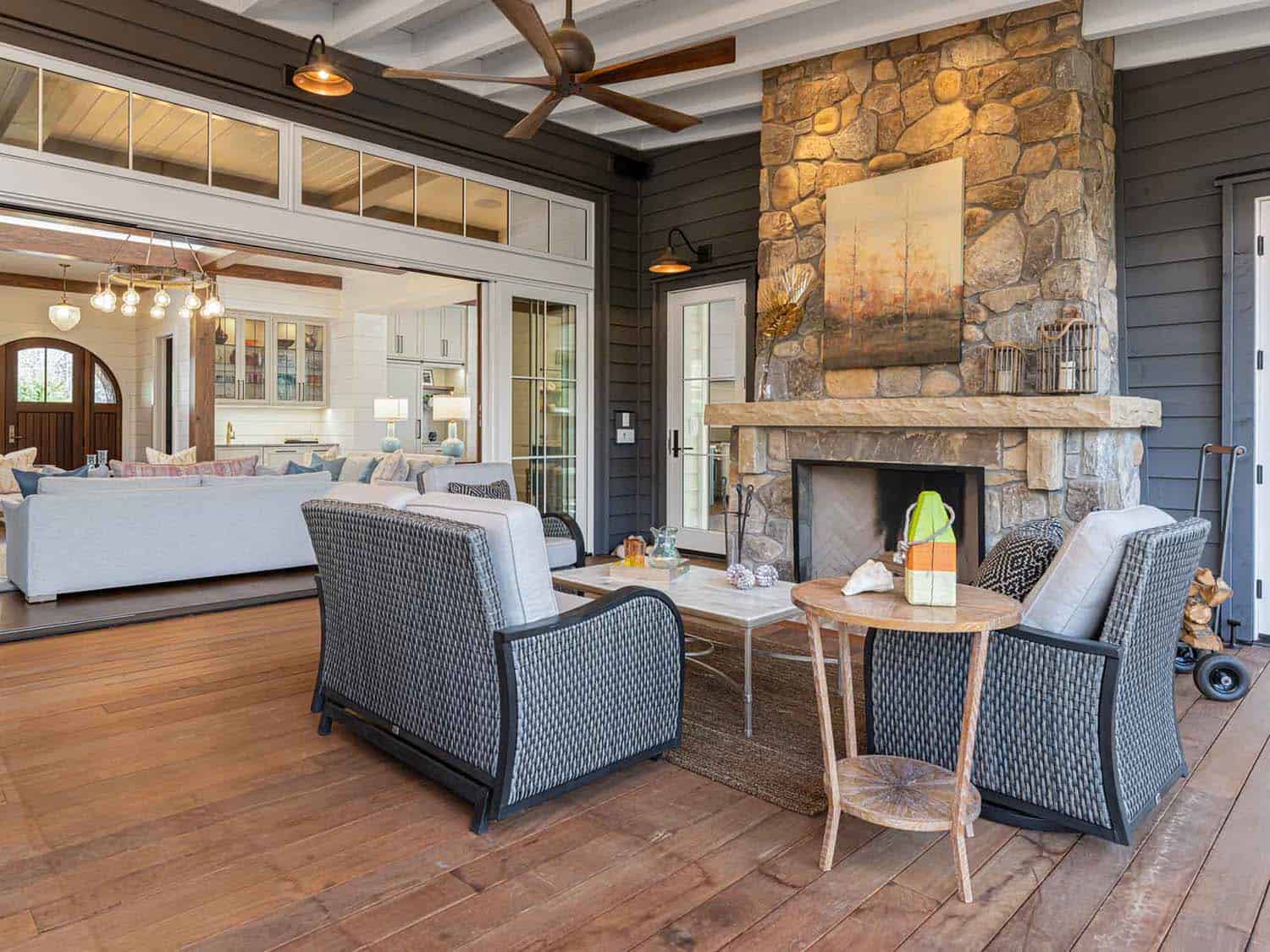 contemporary farmhouse style screened porch with a fireplace