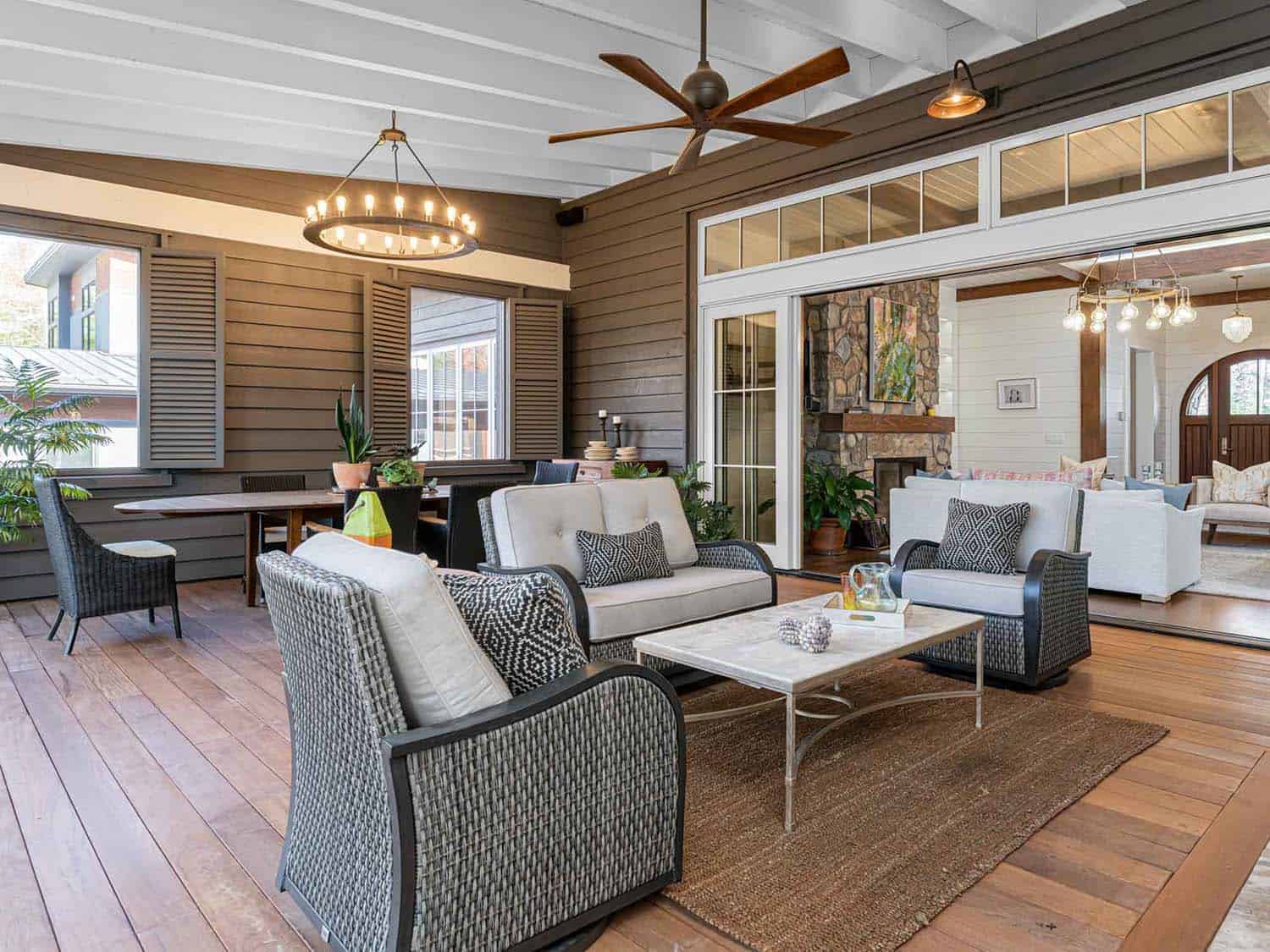 contemporary farmhouse style screened porch with a dining and living room