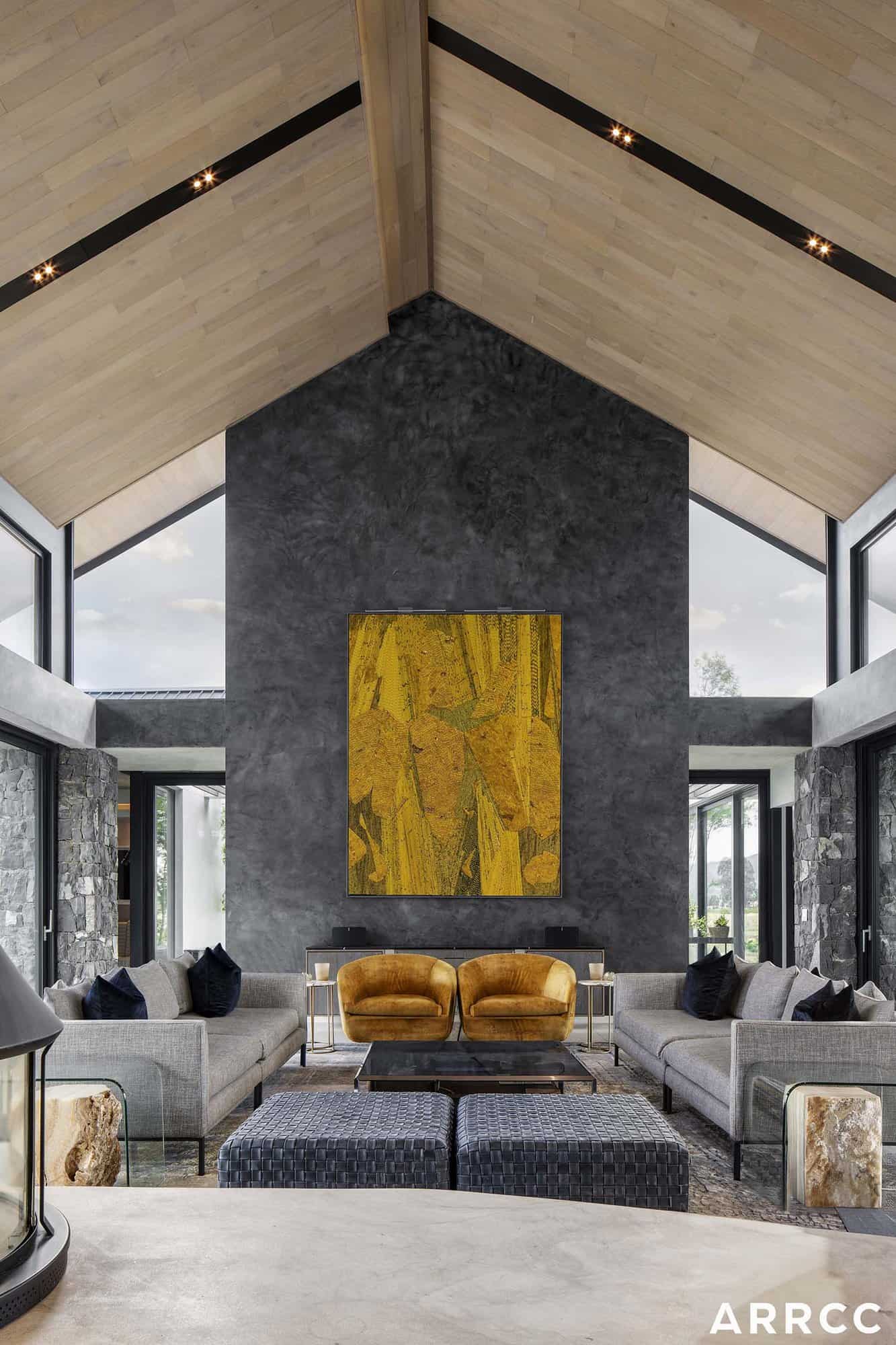 contemporary living room with a pitched roof and concealed lighting