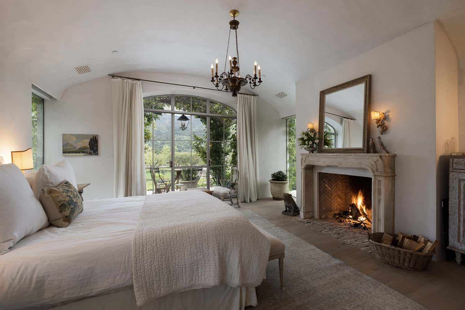 European-inspired bedroom with a fireplace