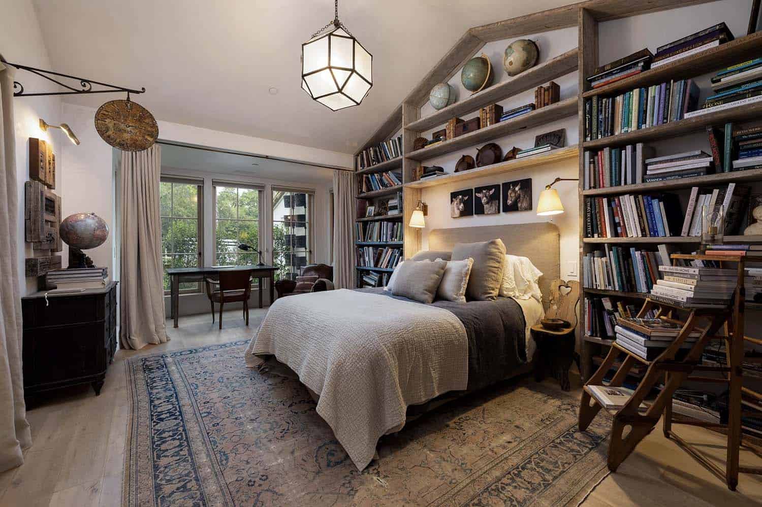 European-inspired bedroom with built-in bookshelves and a writing desk