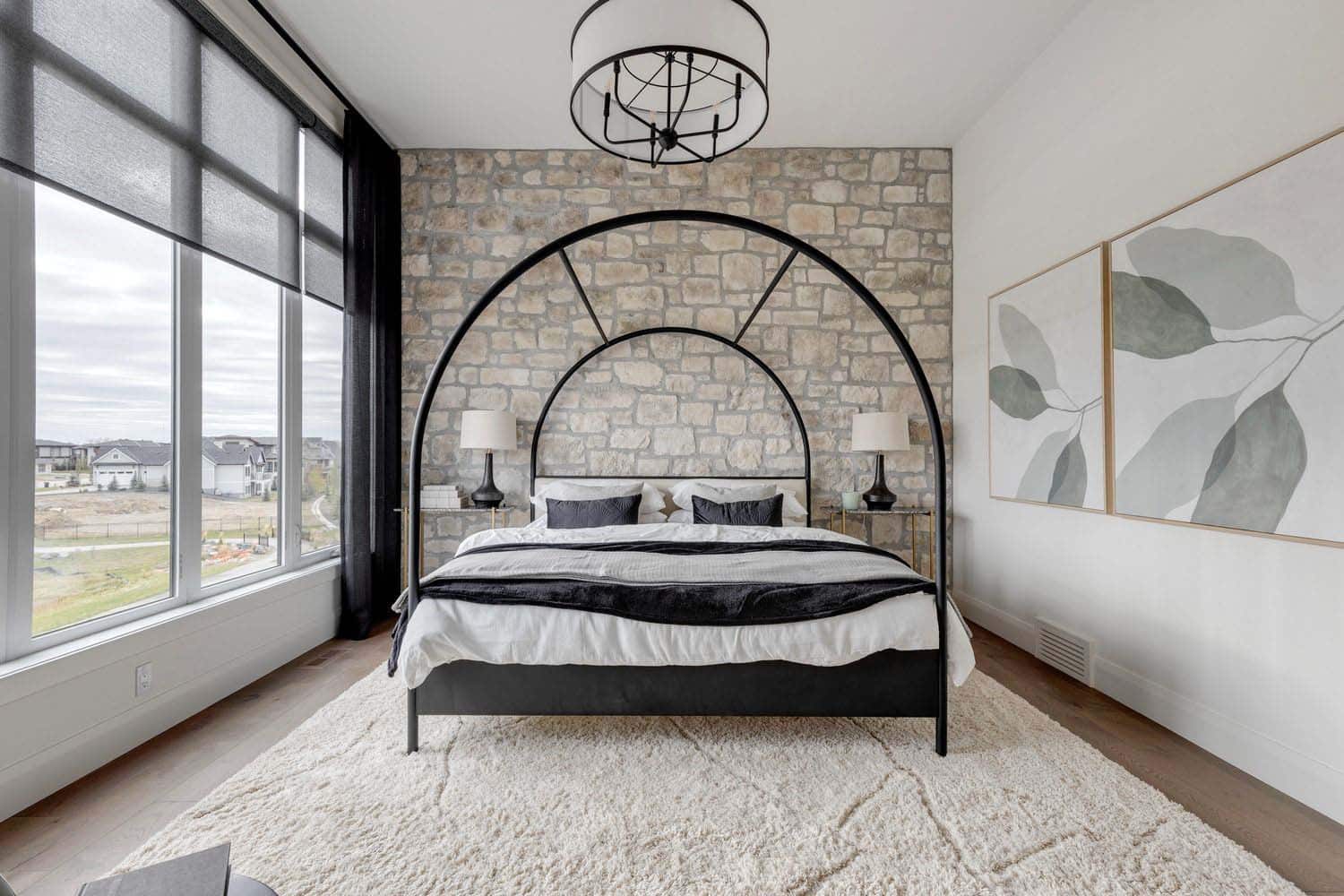 contemporary bedroom with a large chandelier