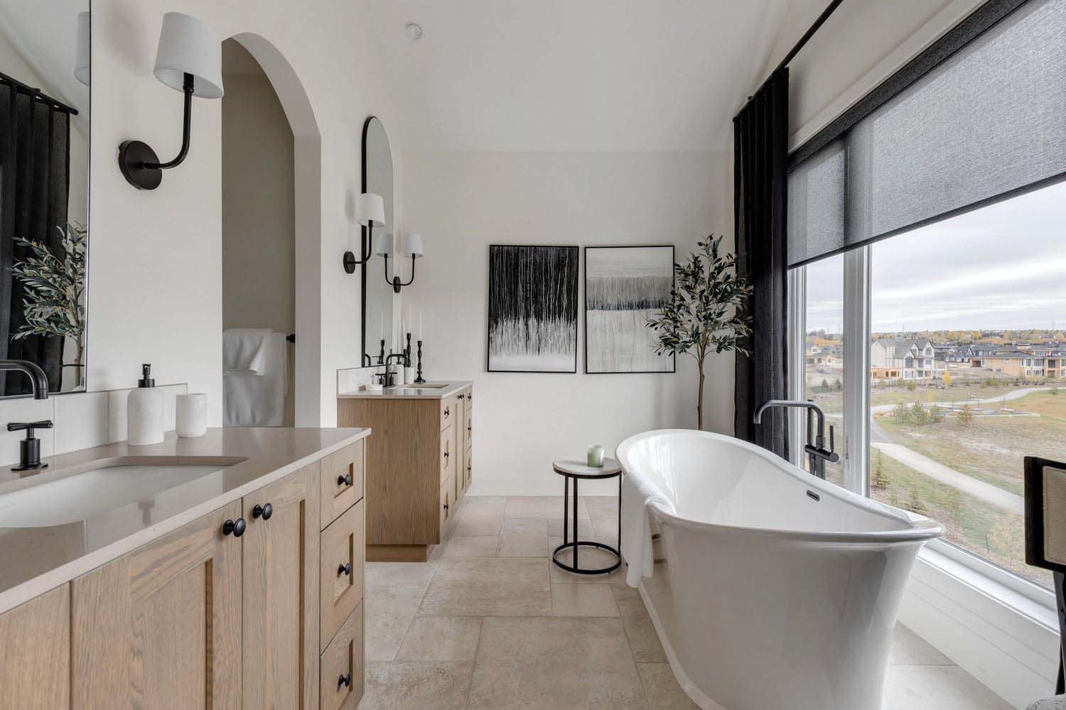 contemporary bathroom with dual vanities and a freestanding tub