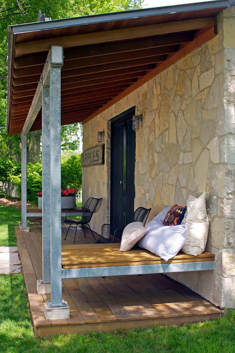 rustic stone guest house exterior with a covered patio