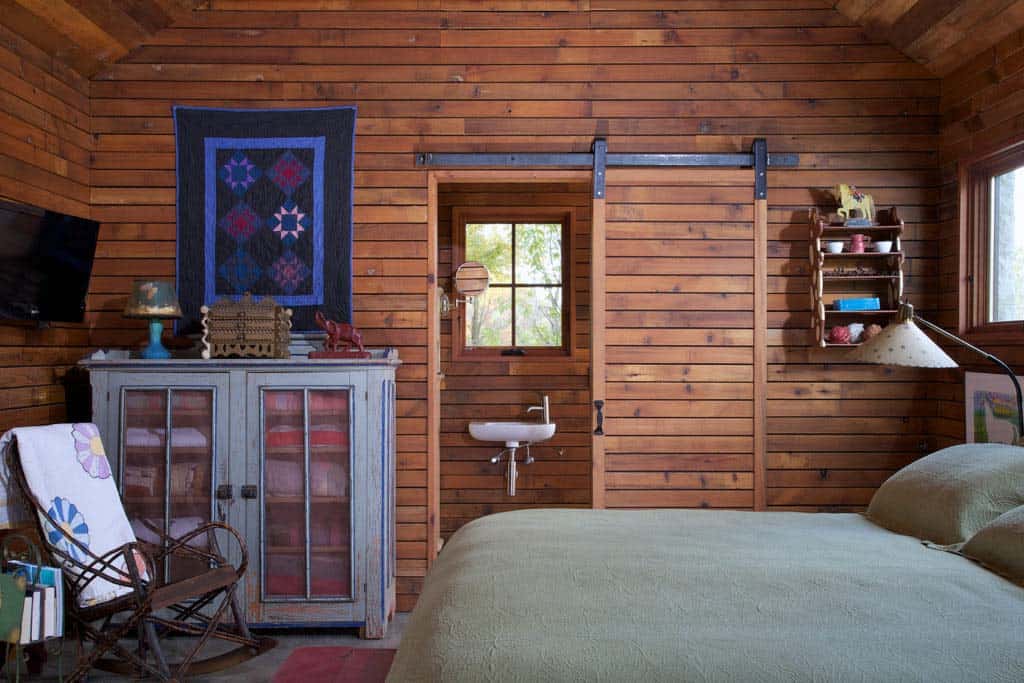 rustic bedroom with a sliding barn door