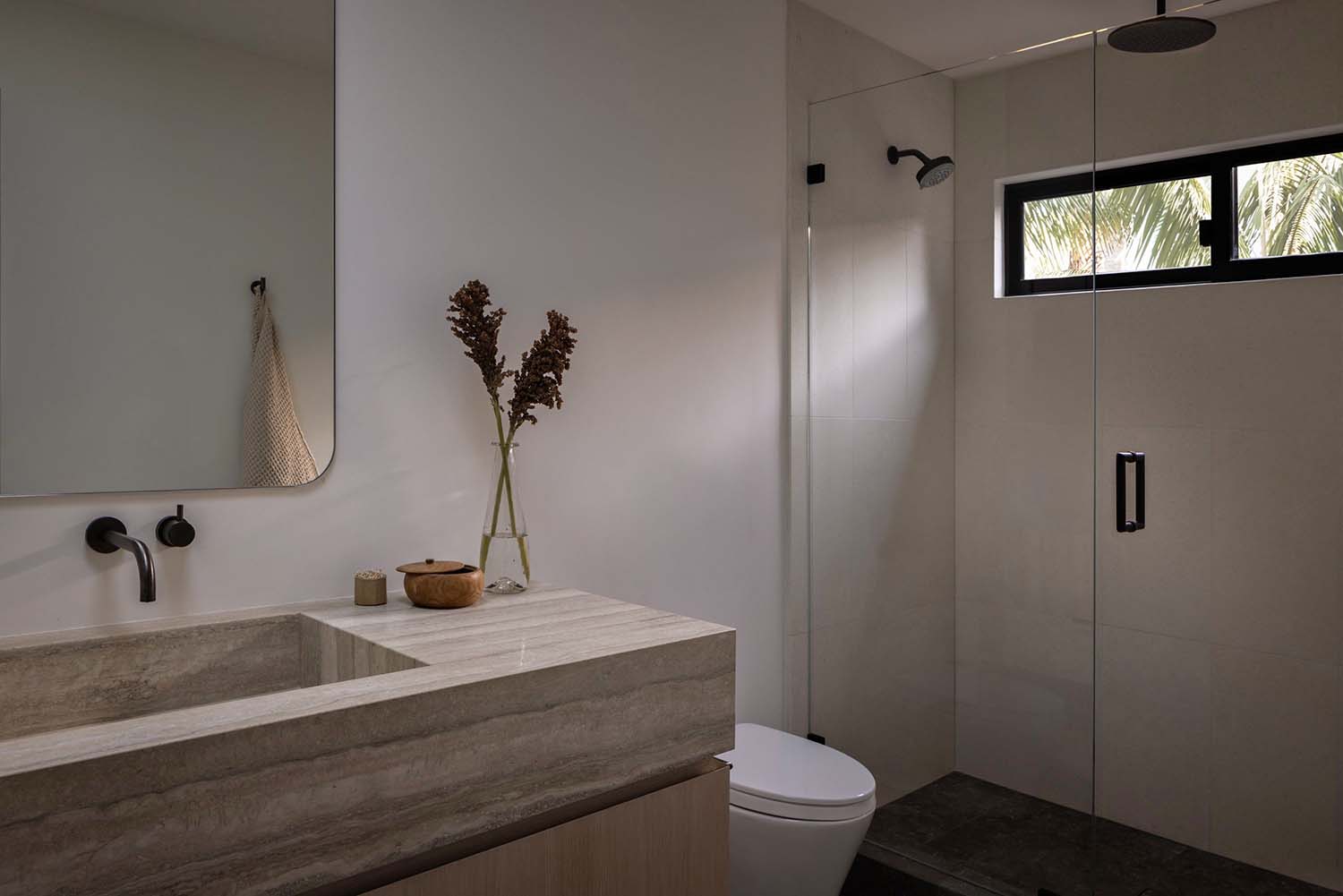midcentury modern bathroom vanity and glass enclosed shower