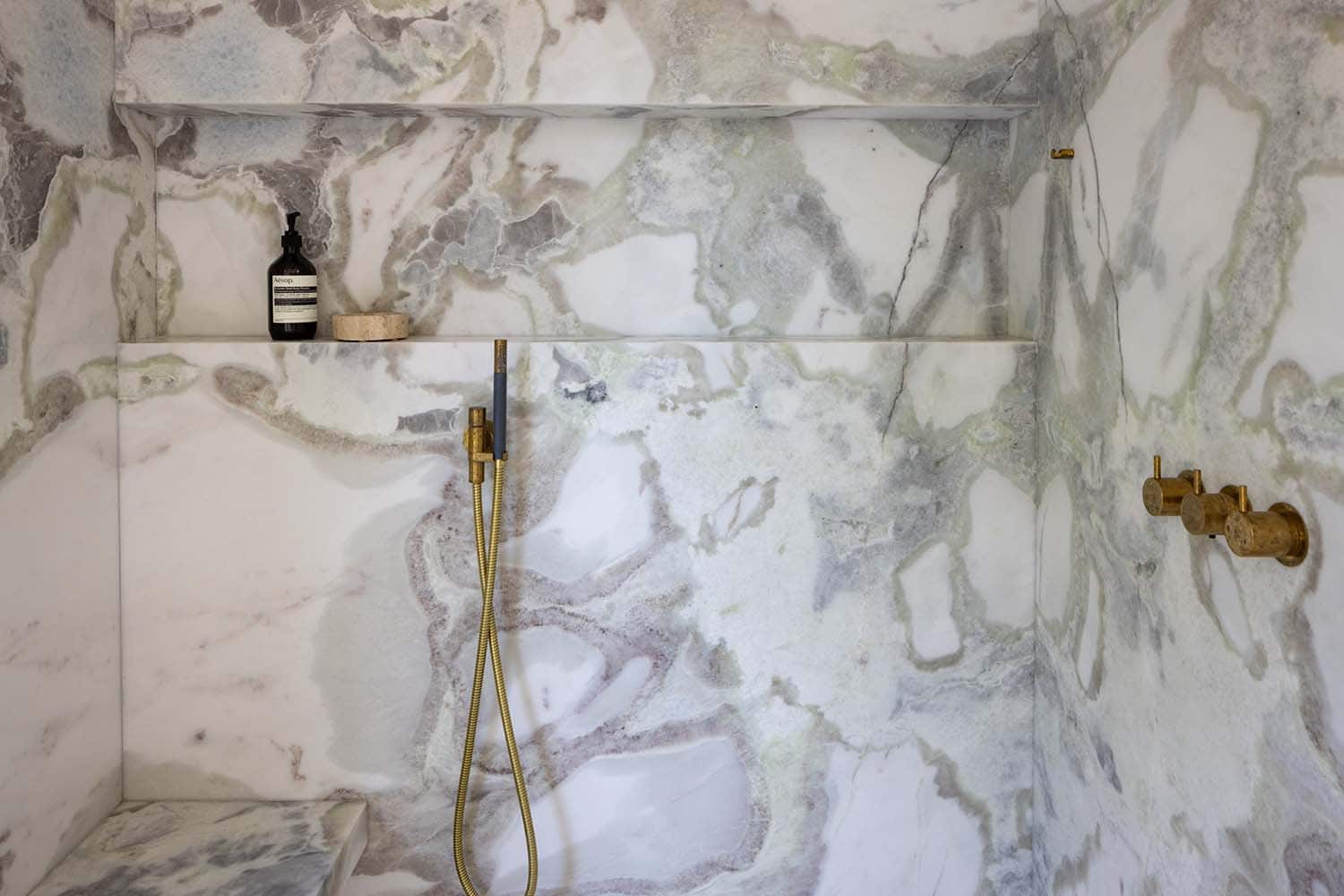 midcentury modern bathroom with a marble shower