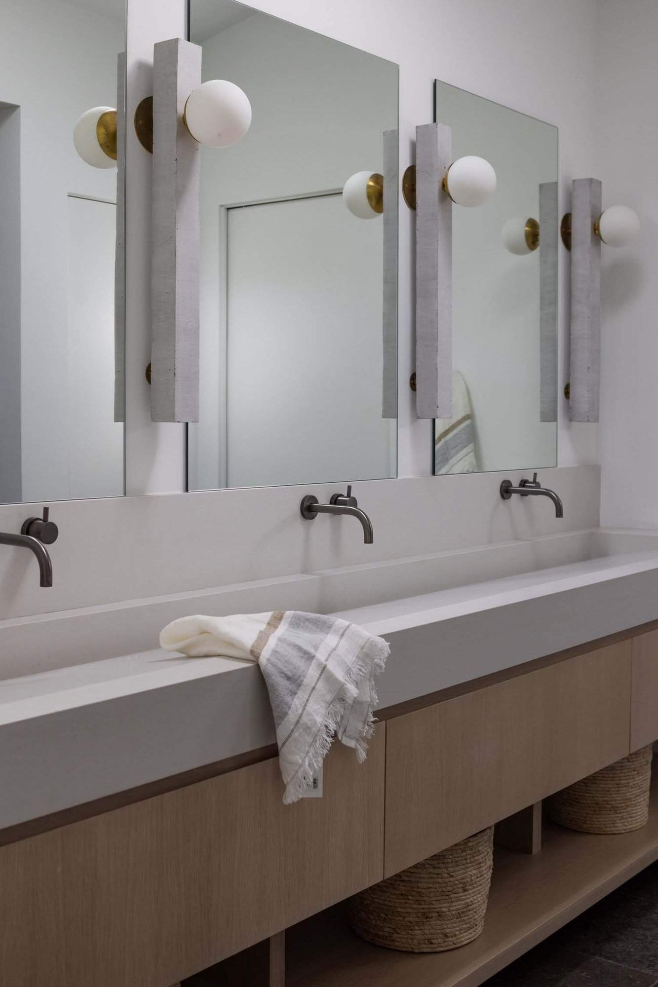 midcentury modern bathroom vanity with a trough sink