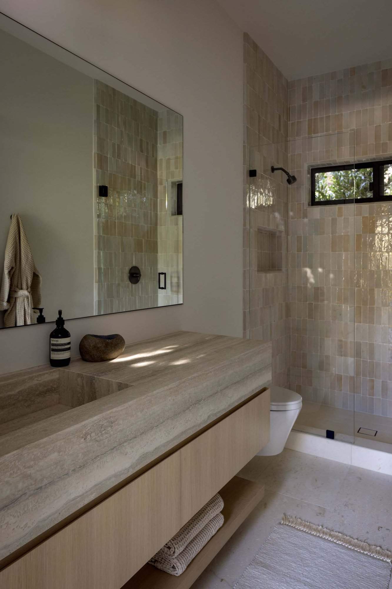 midcentury modern bathroom vanity and glass-enclosed shower