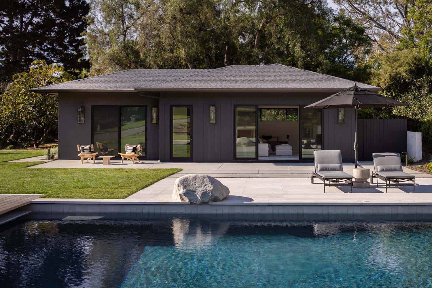 midcentury modern home backyard with a pool