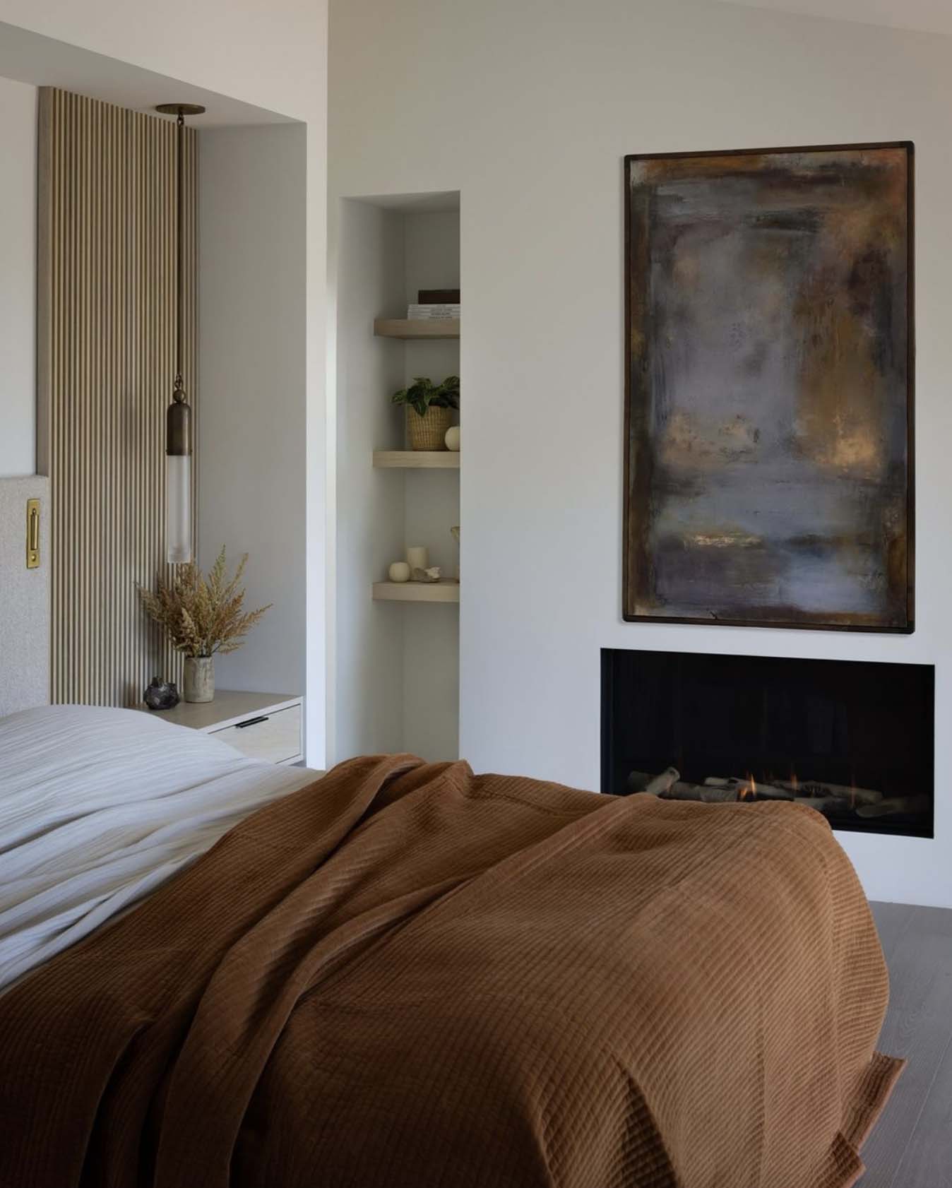 midcentury modern bedroom with a fireplace