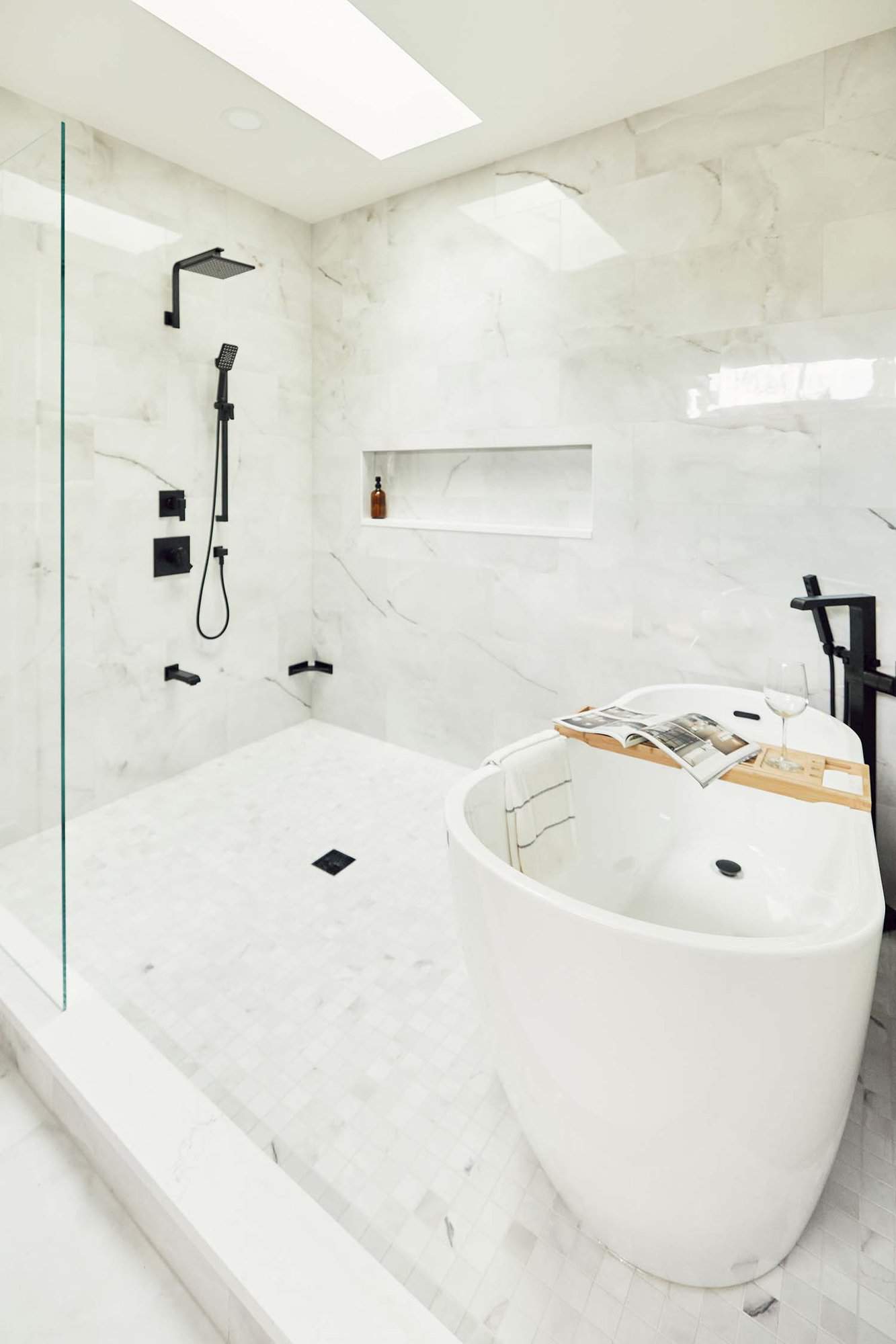 modern bathroom with a walk-in shower and a tub