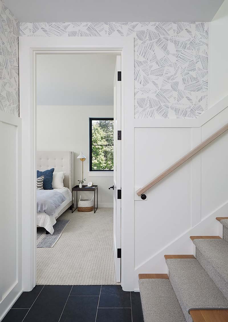modern farmhouse staircase and hall entry into the bedroom