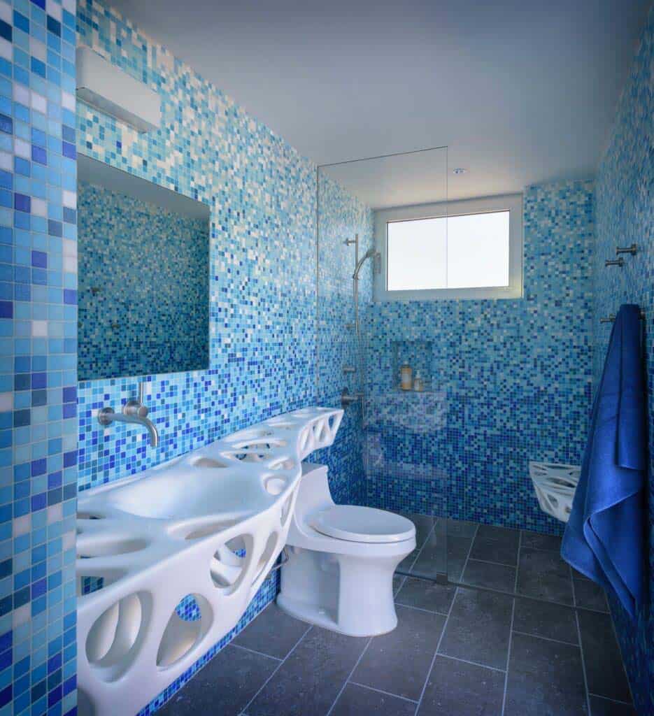 modern bathroom with a floating custom vanity and walk-in shower