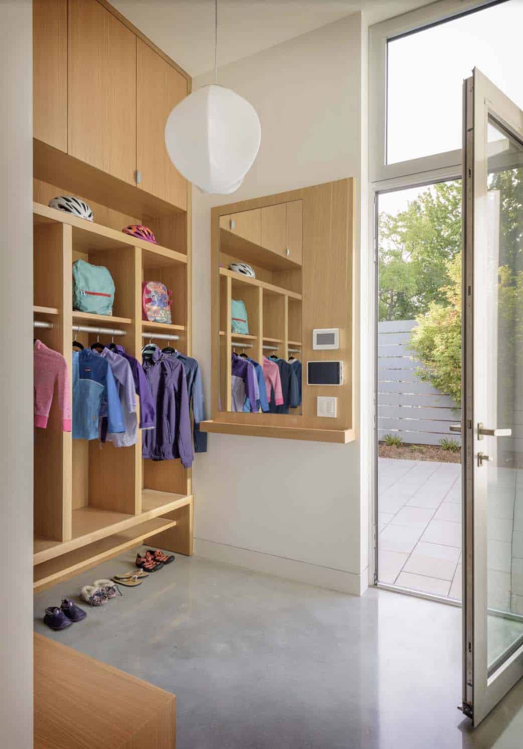 modern home entry with a storage cubby