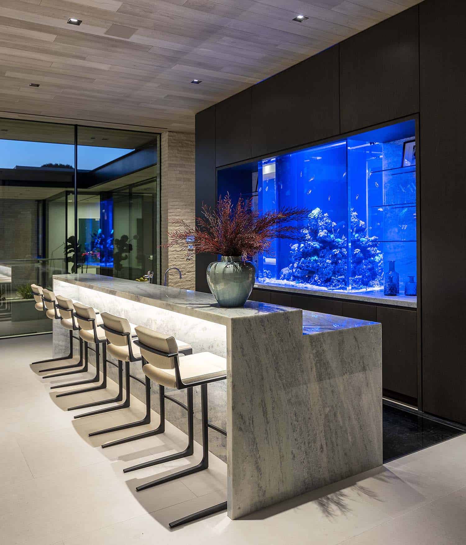 modern home bar with an aquarium backsplash
