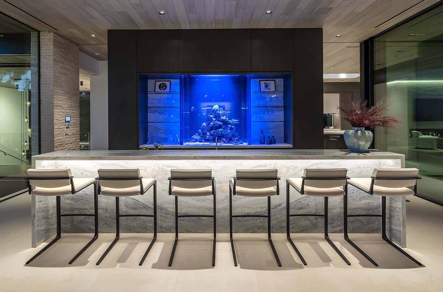 modern home bar with an aquarium backsplash