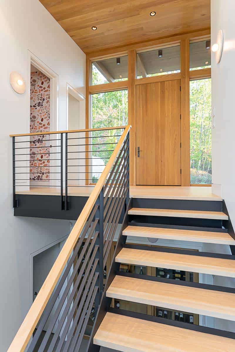 modern mountainside home entry with a staircase