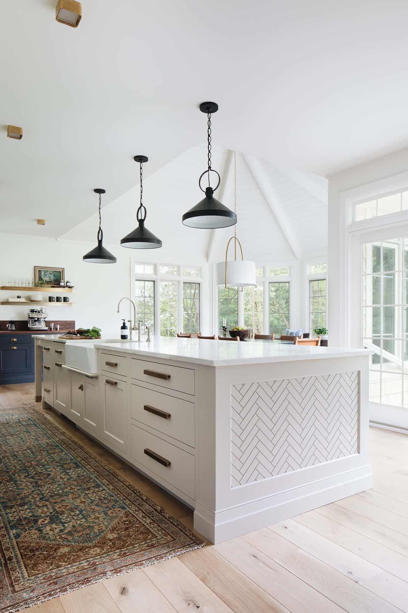 modern Scandinavian kitchen with pendant lights over the island