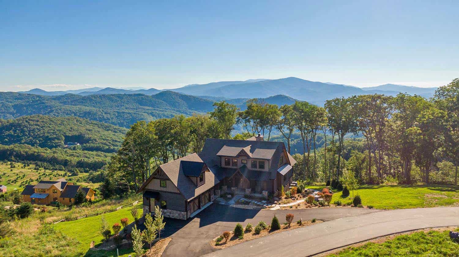 modern rustic mountain home exterior aerial view