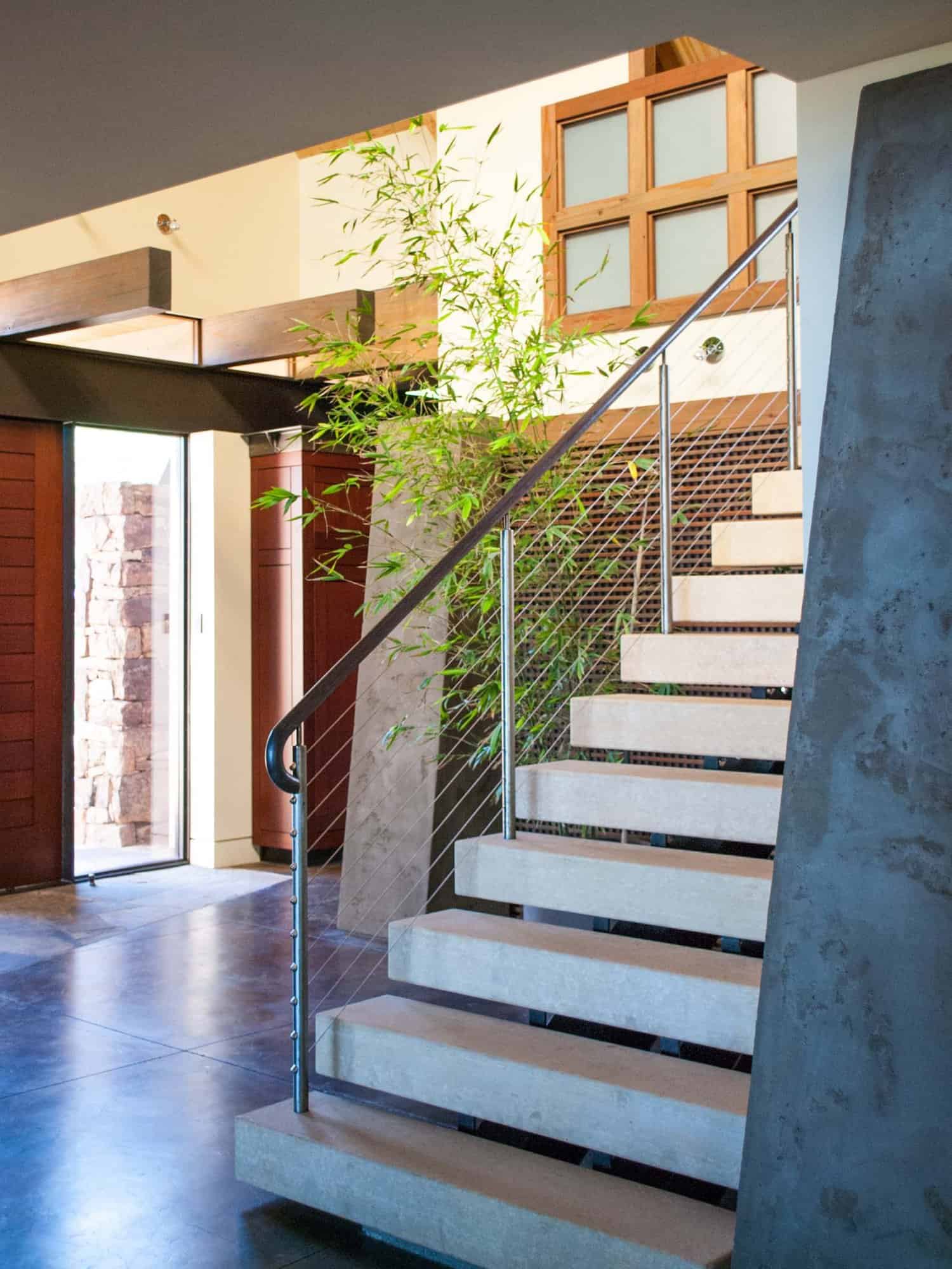 modern staircase with a view of the front door