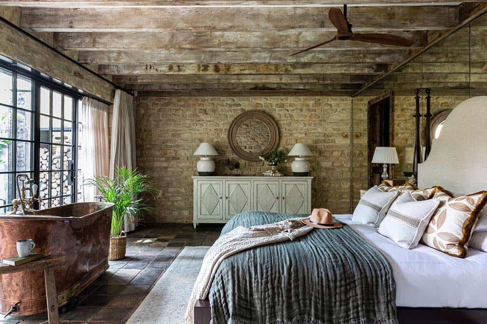 country bedroom with a copper tub
